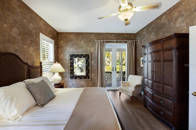 bedroom with dark wood-style floors, access to outside, and a ceiling fan