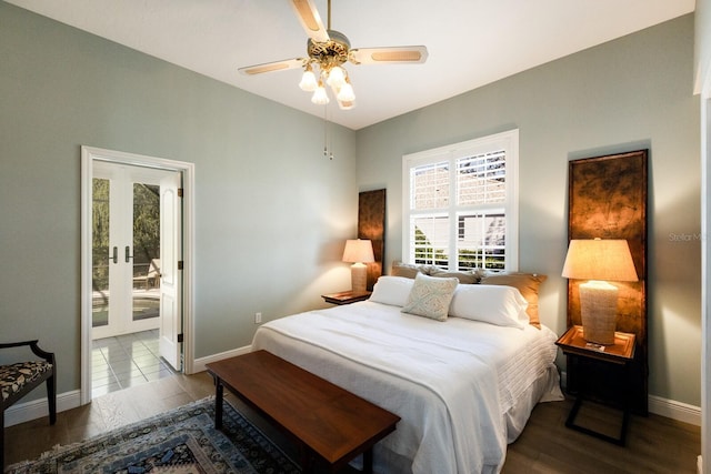 bedroom featuring french doors, ensuite bath, wood finished floors, and baseboards