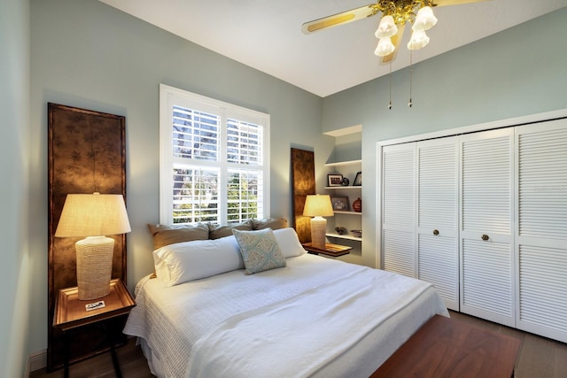 bedroom with ceiling fan and a closet