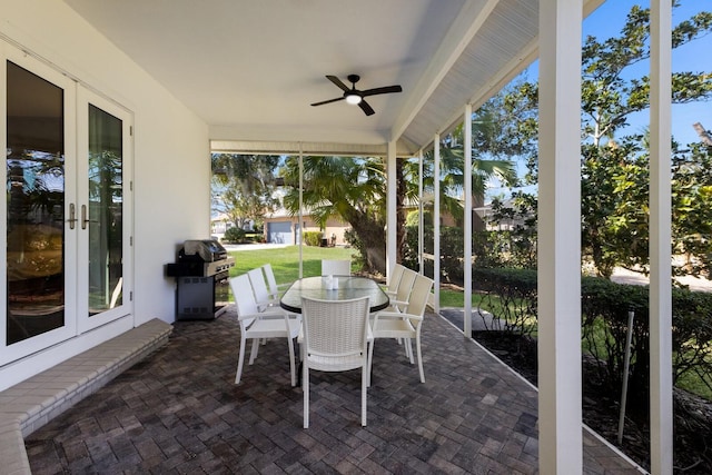 sunroom / solarium with french doors and ceiling fan