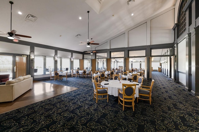 dining area with visible vents, high vaulted ceiling, and ceiling fan