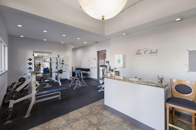 exercise room with recessed lighting