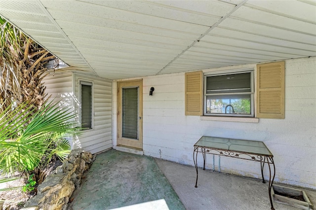 property entrance featuring a patio area