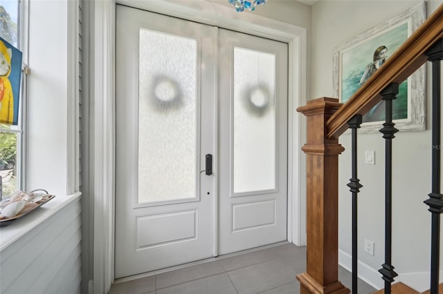 foyer with light tile patterned floors