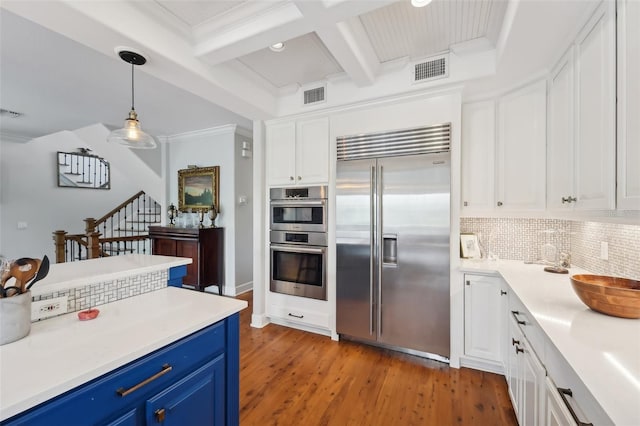 kitchen featuring blue cabinets, tasteful backsplash, appliances with stainless steel finishes, and white cabinets