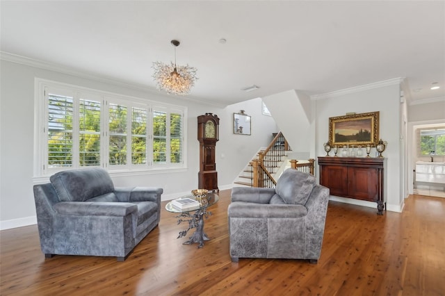 living room featuring crown molding, dark hardwood / wood-style flooring, and a chandelier