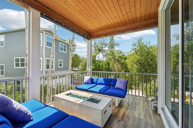 sunroom with wood ceiling and a wealth of natural light