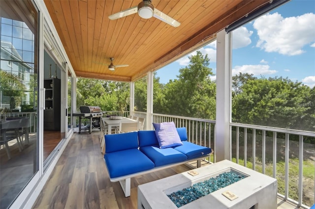 exterior space featuring wooden ceiling and ceiling fan