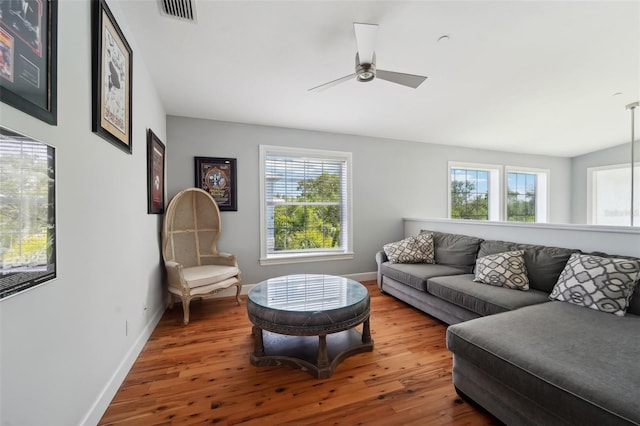 living room with hardwood / wood-style flooring and ceiling fan