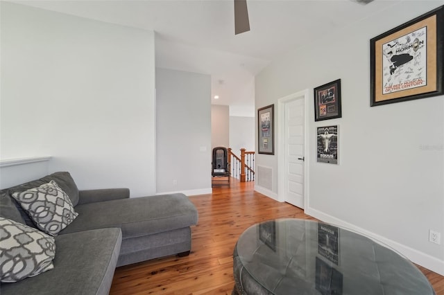 living room with hardwood / wood-style floors and ceiling fan