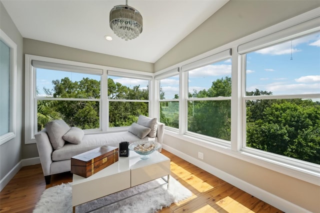 sunroom / solarium with vaulted ceiling