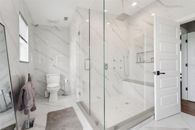 bathroom with toilet and an enclosed shower