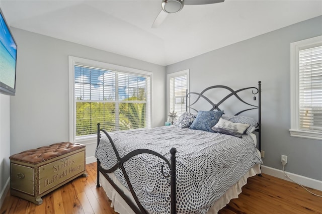 bedroom with hardwood / wood-style flooring and ceiling fan