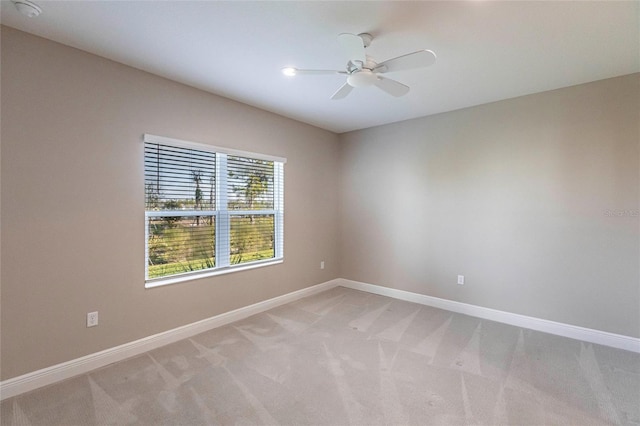 carpeted empty room with ceiling fan