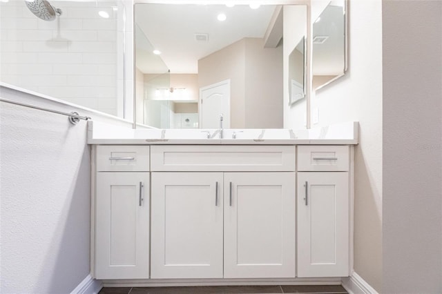 bathroom featuring vanity and walk in shower