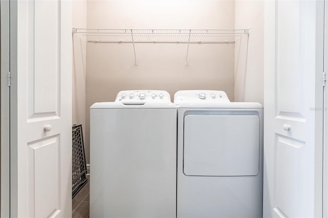 laundry area with washing machine and dryer