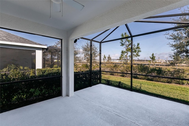 sunroom / solarium featuring ceiling fan