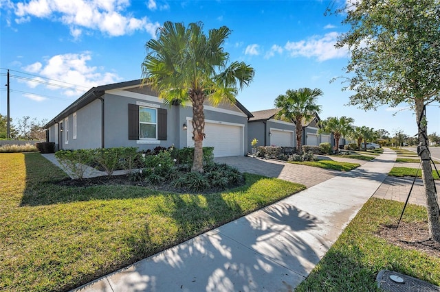 view of front of house featuring a garage and a front yard