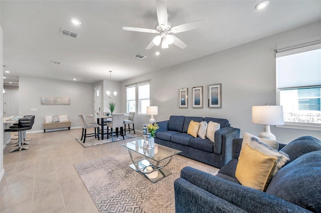 living room with a ceiling fan, recessed lighting, visible vents, and baseboards