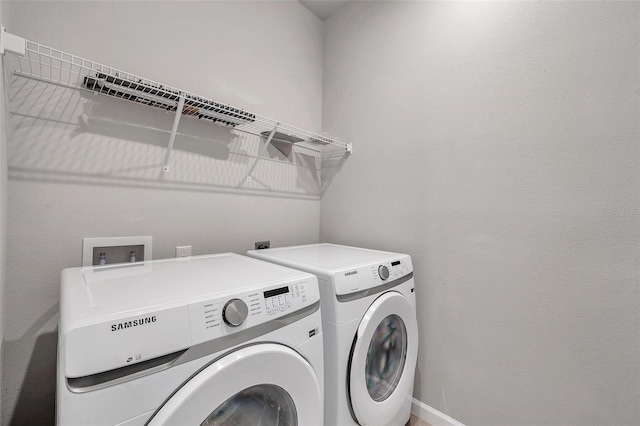 laundry area featuring washing machine and dryer