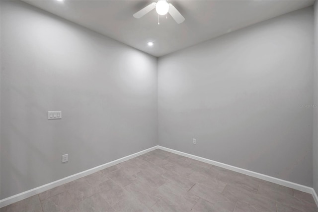 spare room featuring ceiling fan, baseboards, and recessed lighting