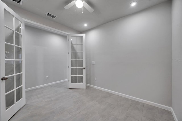 spare room featuring french doors, recessed lighting, visible vents, and baseboards