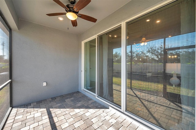 sunroom / solarium with ceiling fan