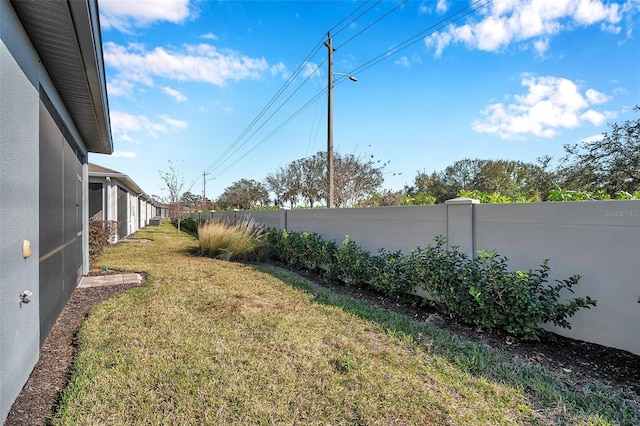 view of yard featuring fence