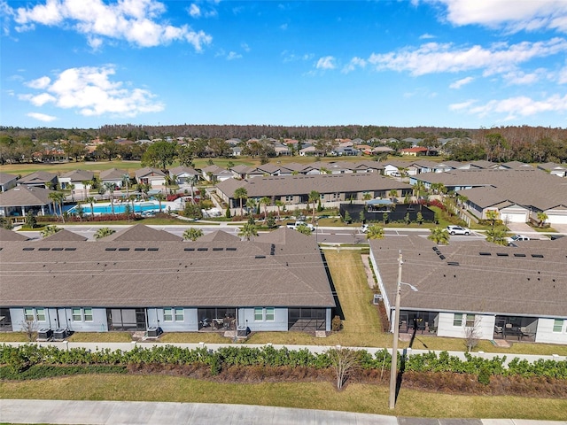 birds eye view of property with a residential view