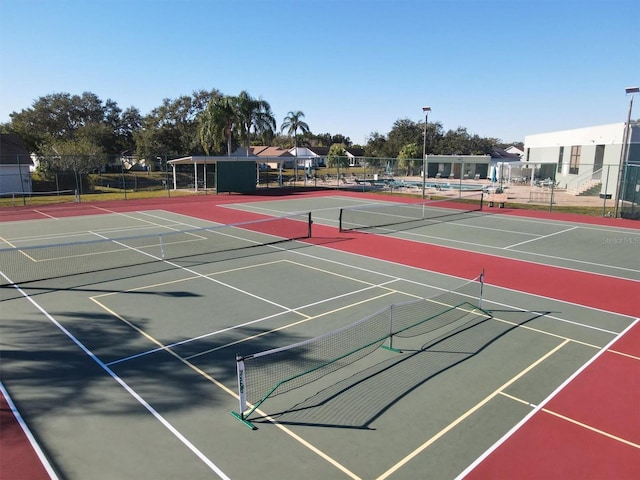 view of sport court with basketball hoop