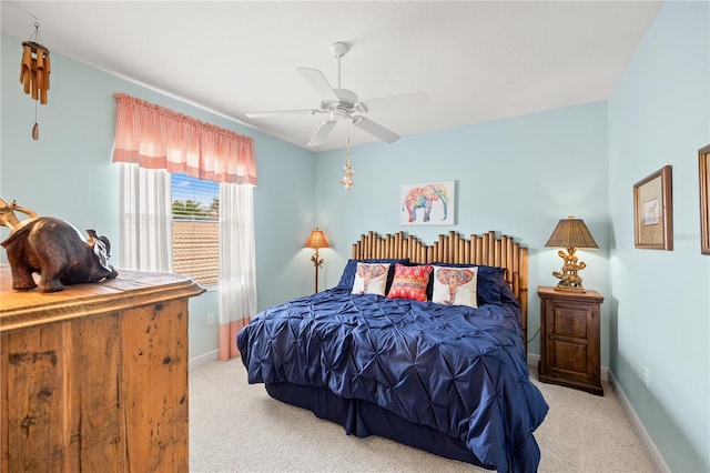 bedroom with light carpet and ceiling fan