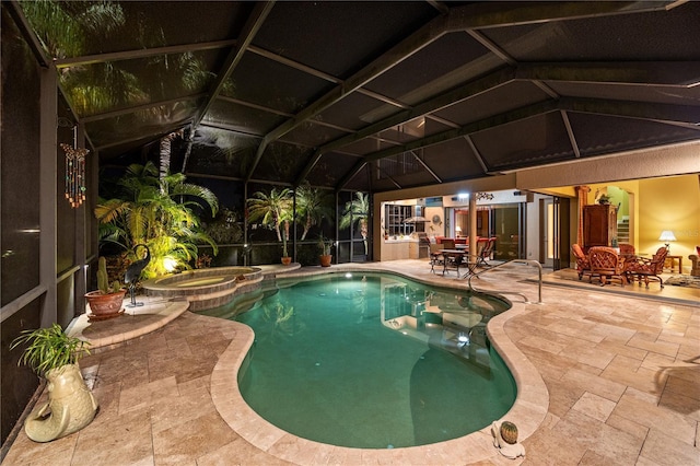 view of pool featuring a lanai, a patio, and an in ground hot tub