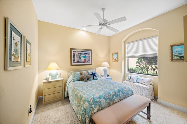 bedroom featuring light carpet and ceiling fan