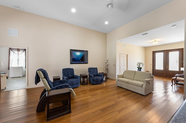 living room featuring wood-type flooring and french doors