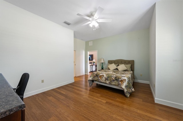 bedroom featuring hardwood / wood-style floors and ceiling fan