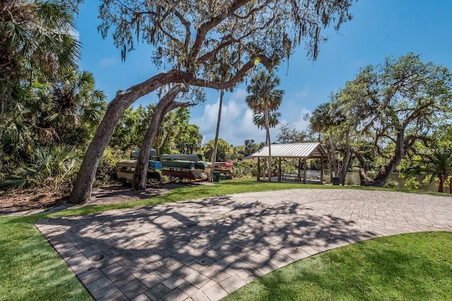 view of property's community with a gazebo and a lawn