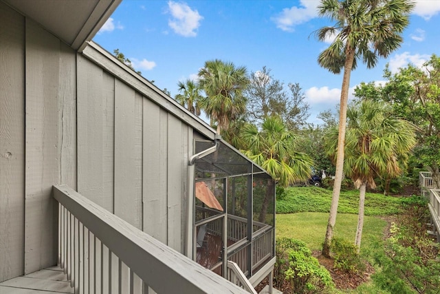 view of yard with glass enclosure