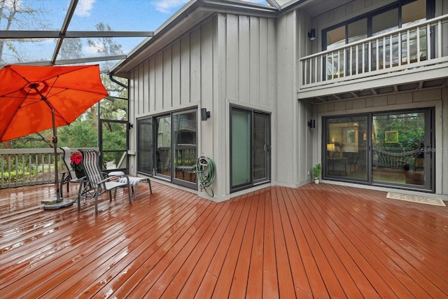 wooden deck with glass enclosure