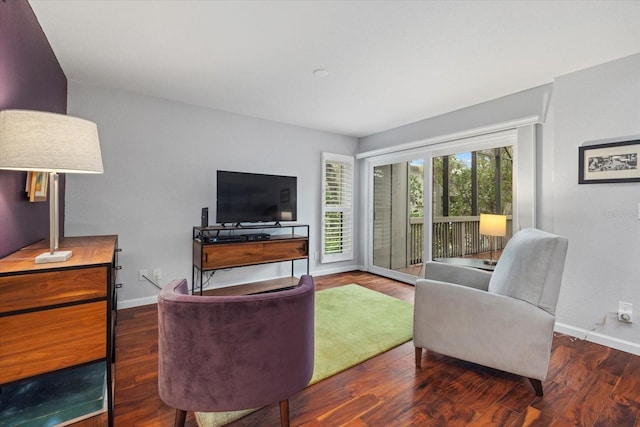 living room with dark hardwood / wood-style flooring