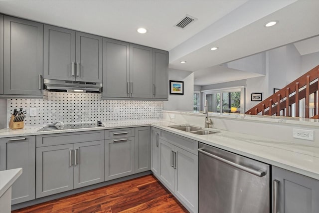 kitchen with sink, gray cabinets, backsplash, black electric cooktop, and stainless steel dishwasher