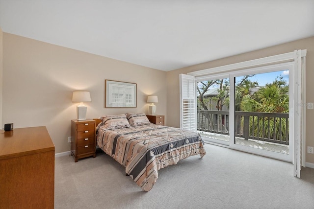 bedroom featuring access to outside and light colored carpet