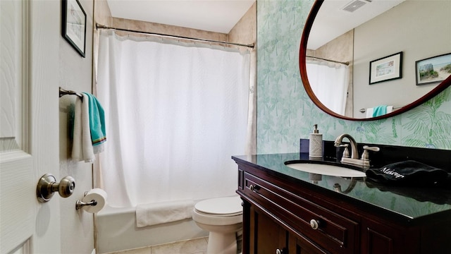 full bathroom featuring vanity, shower / tub combo, tile patterned floors, and toilet