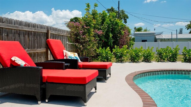 view of pool featuring a patio area