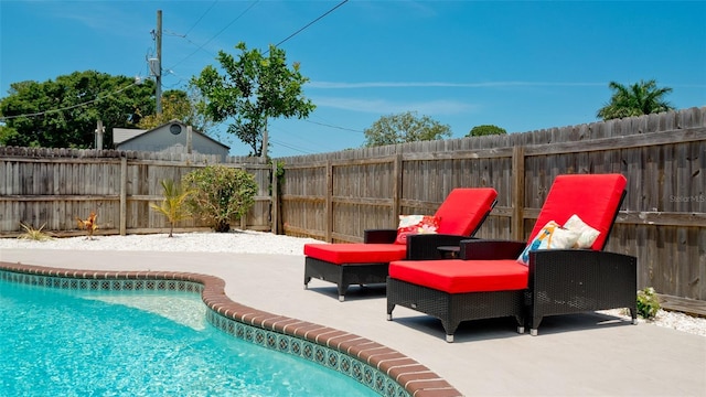 view of pool featuring a patio area