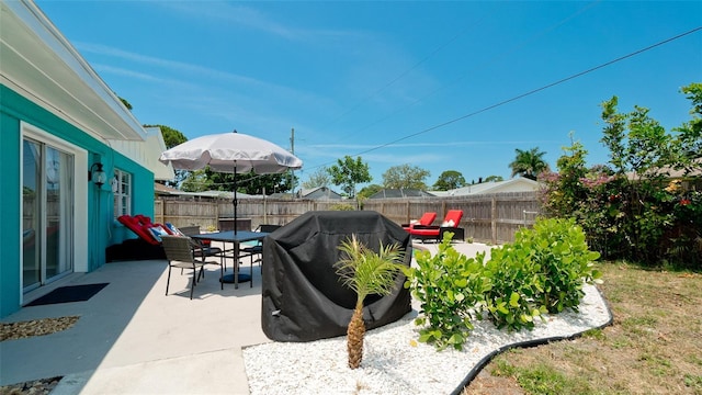 view of patio featuring a grill