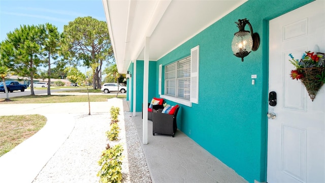 view of exterior entry featuring a porch