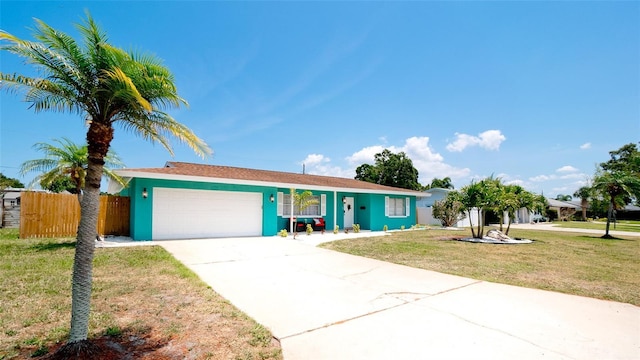 ranch-style house with a garage and a front lawn