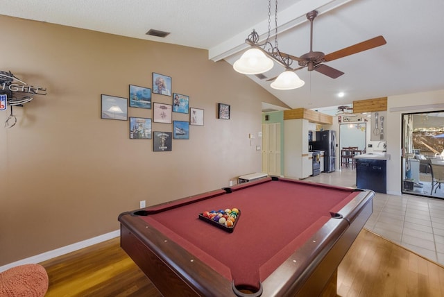 game room with hardwood / wood-style flooring, vaulted ceiling with beams, and ceiling fan