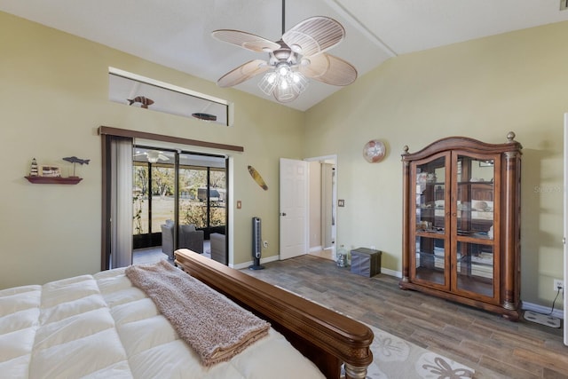 bedroom featuring hardwood / wood-style flooring, lofted ceiling, access to outside, and ceiling fan