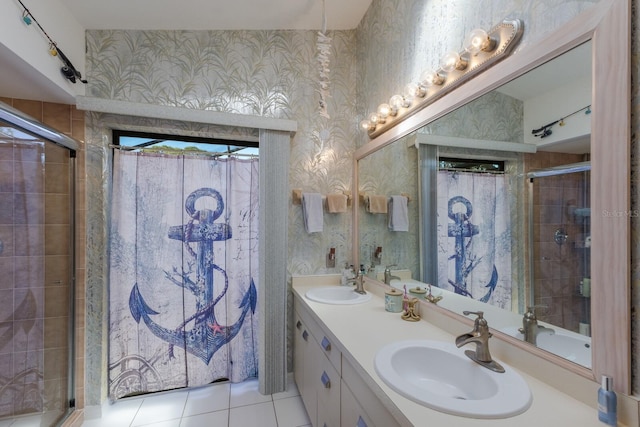 bathroom with tile patterned flooring, vanity, and a shower with shower door